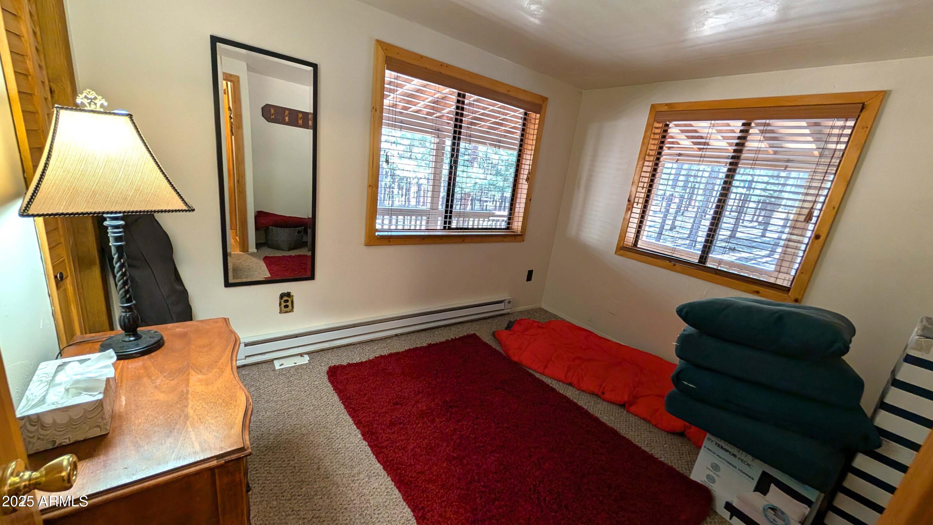 2425 Tall Trees Loop Forest Lakes, AZ 85931 - Photo 24 of 43 a bedroom with a bed and a window