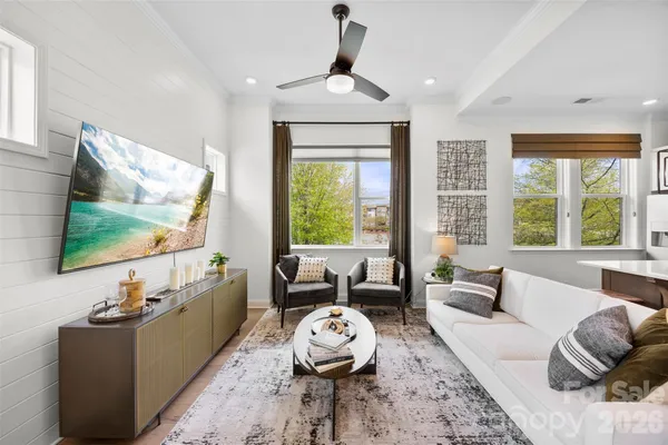 a kitchen with stainless steel appliances a sink a stove and a wooden floors