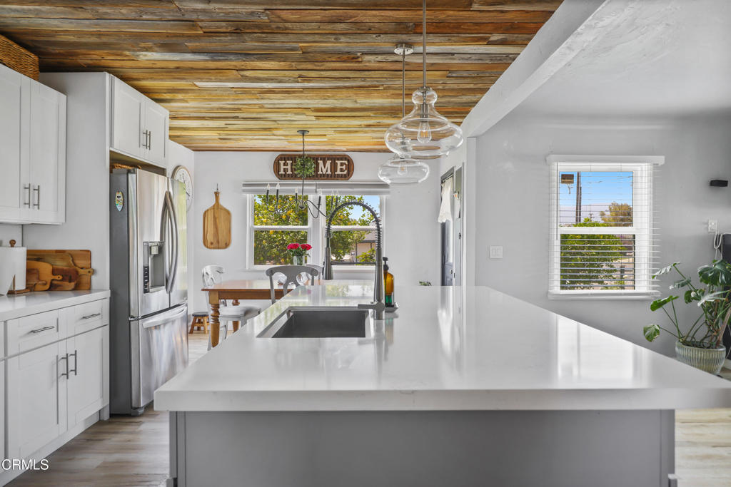 300 C Street Fillmore, CA 93015 - Photo 11 of 41 a kitchen with stainless steel appliances a sink a counter space cabinets and furniture