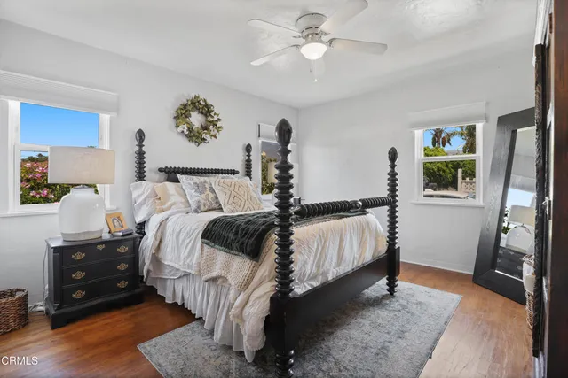 a bed room with a bed and a chandelier
