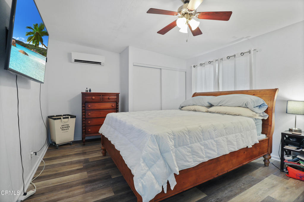 300 C Street Fillmore, CA 93015 - Photo 35 of 41 a bedroom with bed and wooden floor
