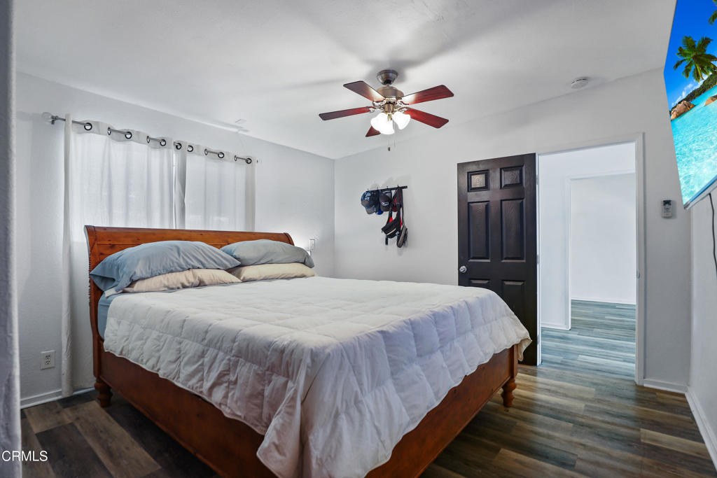 300 C Street Fillmore, CA 93015 - Photo 36 of 41 a bedroom with bed and wooden floor