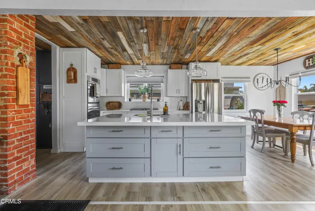 a kitchen with a wooden floor and a sink