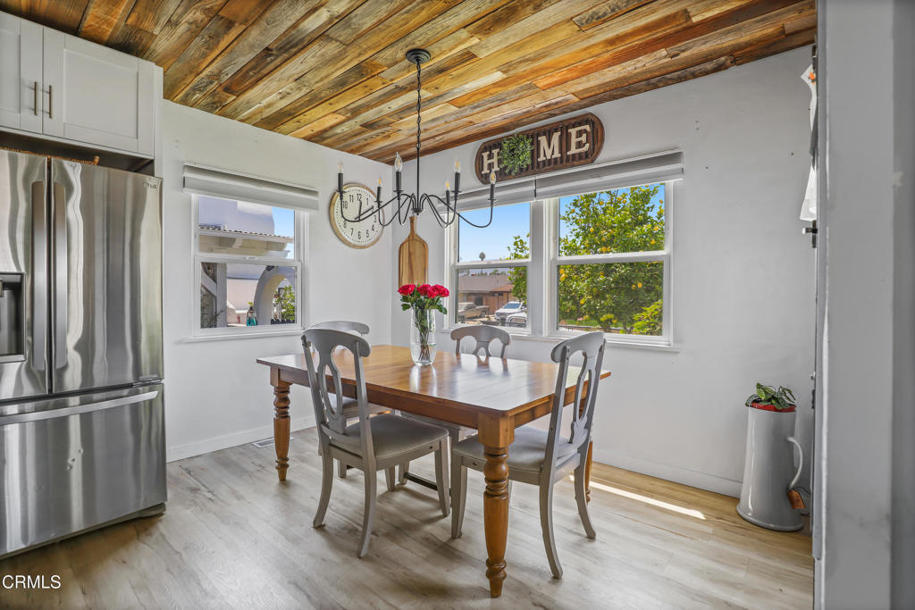 300 C Street Fillmore, CA 93015 - Photo 9 of 41 a dining room with furniture a chandelier and wooden floor