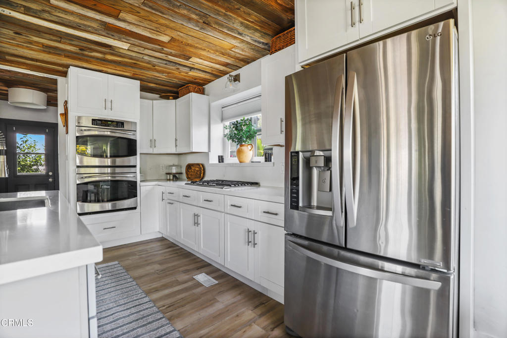 300 C Street Fillmore, CA 93015 - Photo 10 of 41 a kitchen with stainless steel appliances a refrigerator sink and cabinets