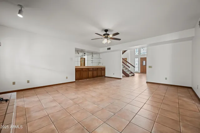 a kitchen with stainless steel appliances granite countertop a sink counter space and a stove