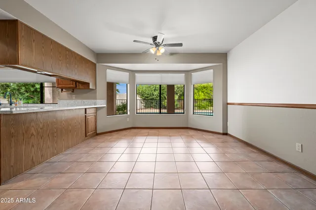 a kitchen with stainless steel appliances granite countertop a sink and cabinets