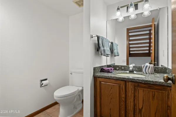 a large kitchen with a window and stainless steel appliances