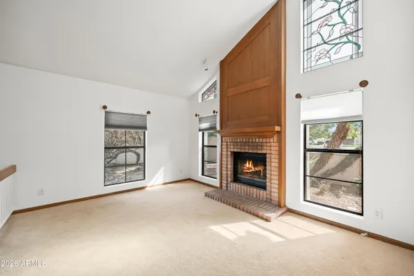 a view of an empty room and a window