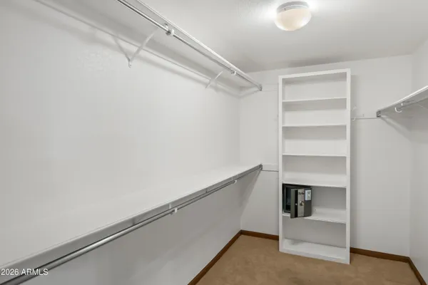 a bathroom with a double vanity sink toilet and a mirror