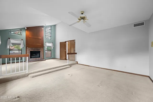 a spacious bathroom with a double vanity sink a large mirror and a shower