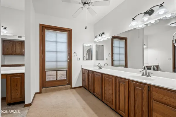 a view of a house with swimming pool and a yard