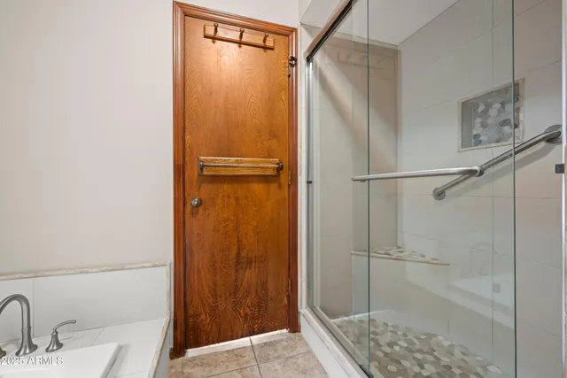 a bathroom with a double vanity sink toilet and a mirror