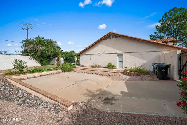 an aerial view of house with yard swimming pool and outdoor seating