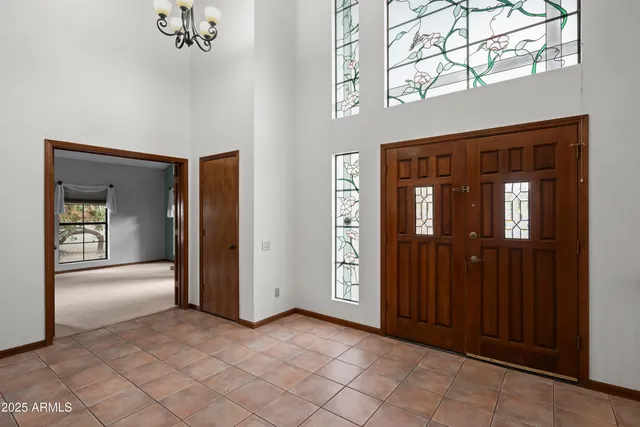 a view of an empty room with a ceiling fan