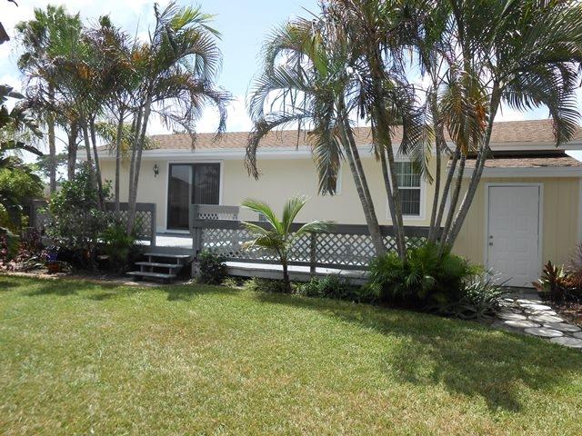22829 Southwest 65th Way Boca Raton, FL 33428 - Photo 19 of 21 a view of a house with a yard and a large tree