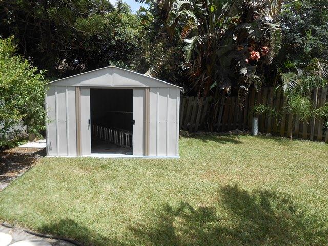 22829 Southwest 65th Way Boca Raton, FL 33428 - Photo 20 of 21 a front view of a house with a yard