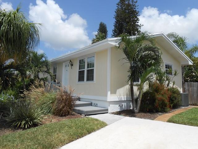 22829 Southwest 65th Way Boca Raton, FL 33428 - Photo 2 of 21 a view of a house with a yard and plants
