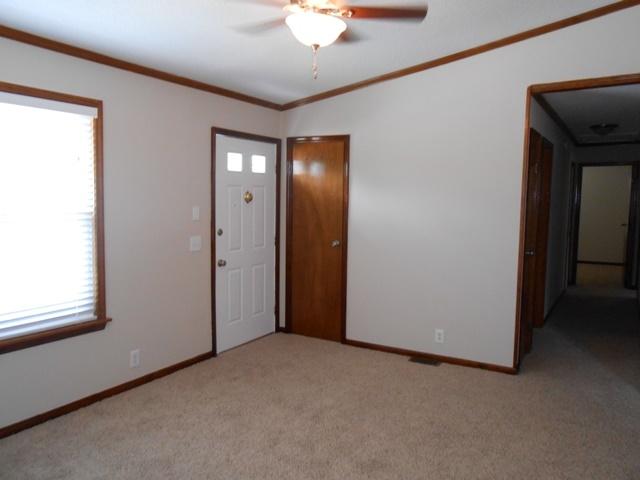 22829 Southwest 65th Way Boca Raton, FL 33428 - Photo 3 of 21 an empty room with a window and a chandelier fan