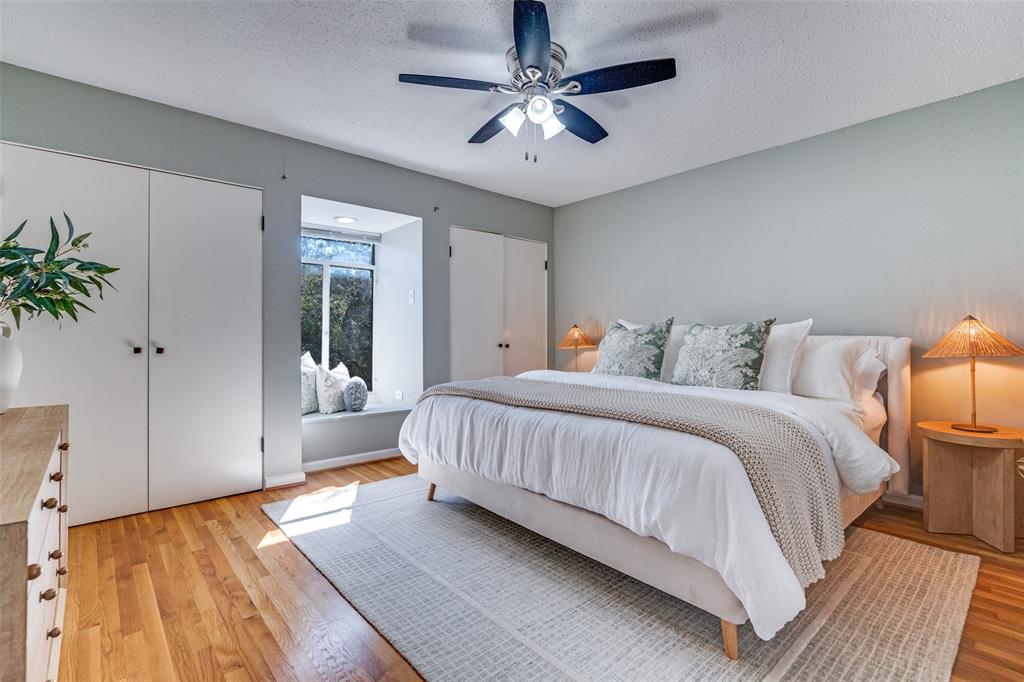 3623 Hawthorne Avenue Dallas, TX 75219 - Photo 18 of 28 Light filled bedroom with hardwood floors and recessed window.