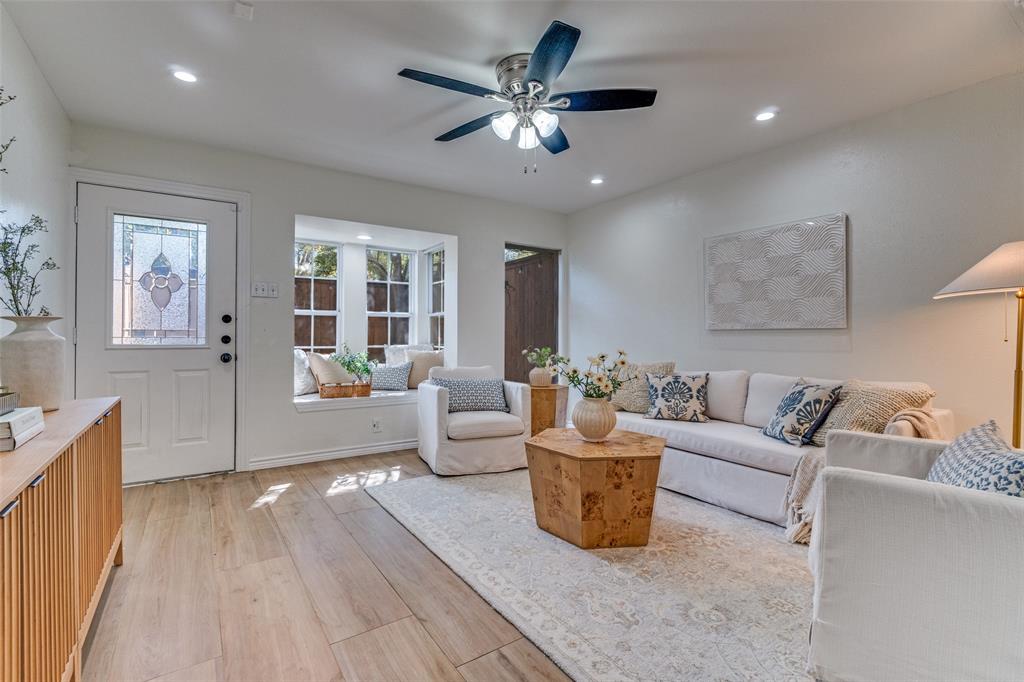 3623 Hawthorne Avenue Dallas, TX 75219 - Photo 3 of 28 Bright and welcoming living area with wide plank flooring and recessed lighting.