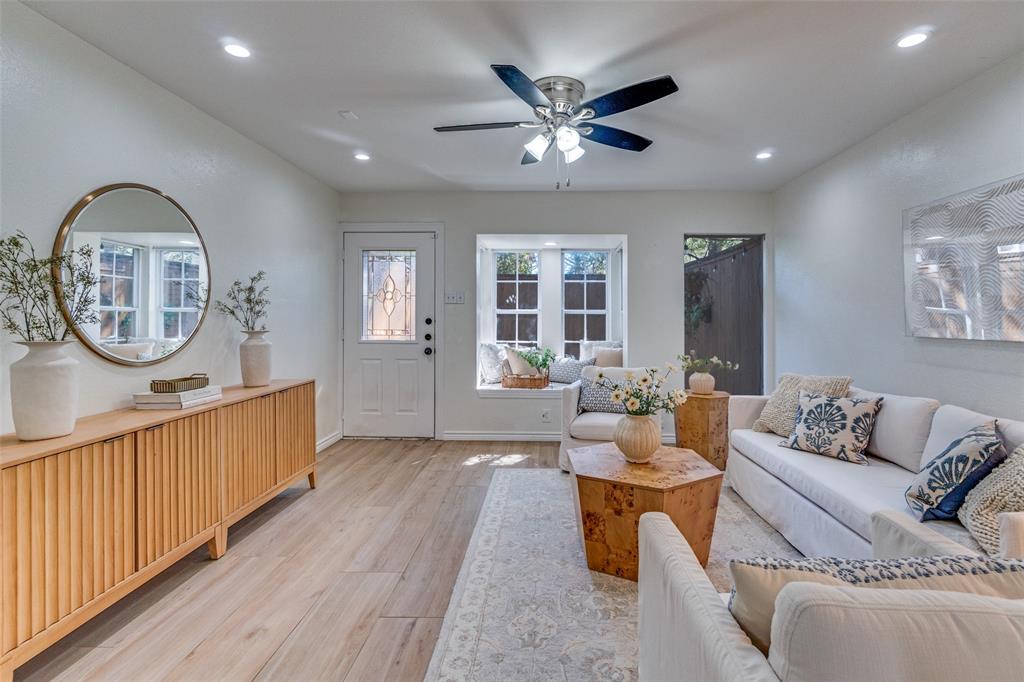 3623 Hawthorne Avenue Dallas, TX 75219 - Photo 5 of 28 Oversized windows and a glass paneled front door bring in abundant natural light.