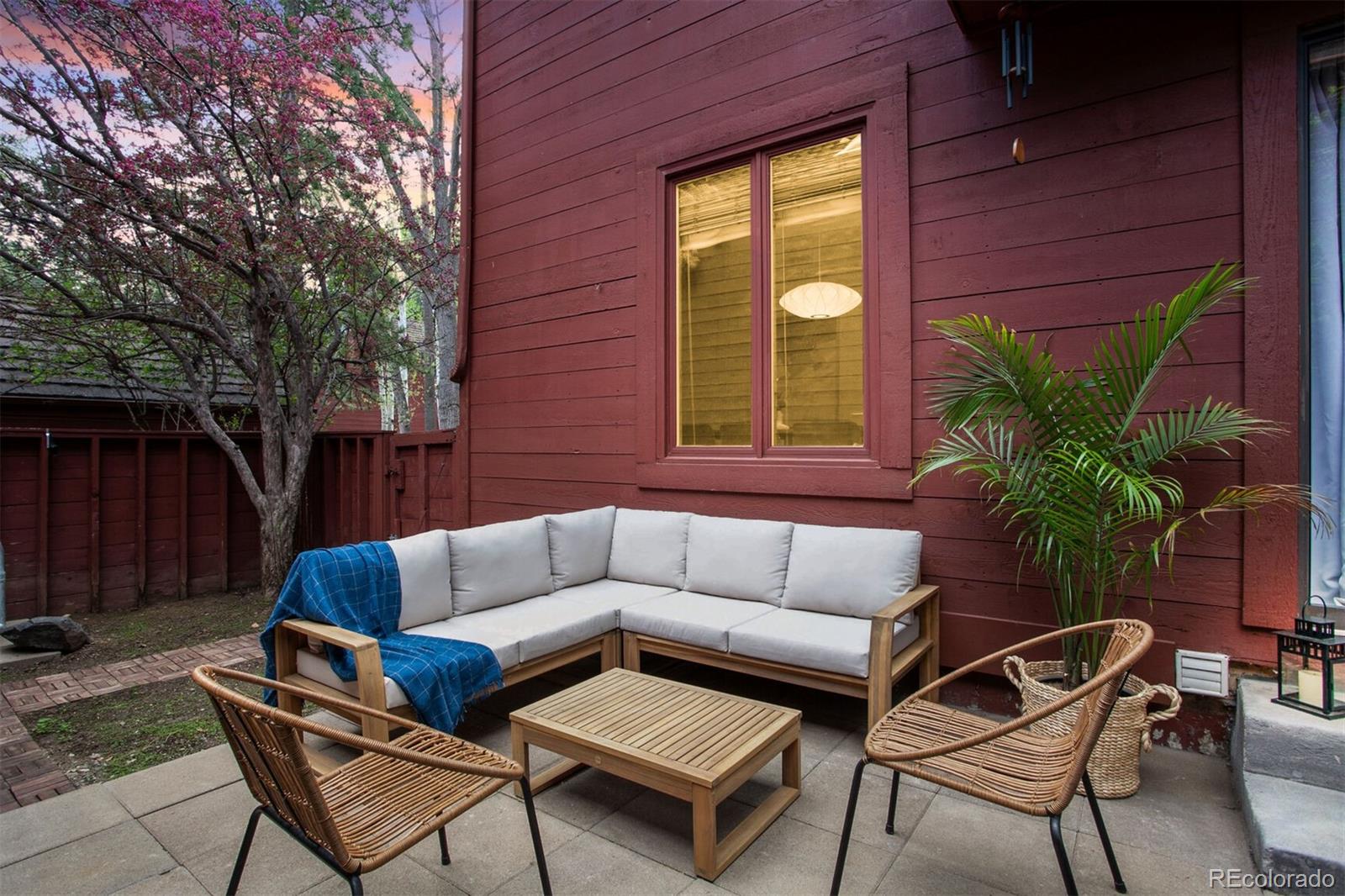 23646 Genesee Village Road Golden, CO 80401 - Photo 21 of 29 a view of a backyard with furniture and a potted plant