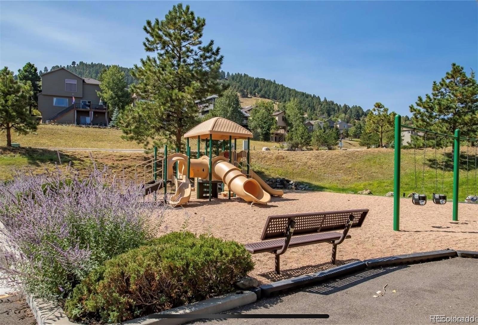 23646 Genesee Village Road Golden, CO 80401 - Photo 27 of 29 swimming pool with outdoor seating and garden