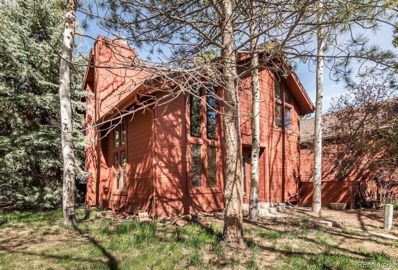 23646 Genesee Village Road Golden, CO 80401 - Photo 29 of 29 a backyard of a house with lots of green space