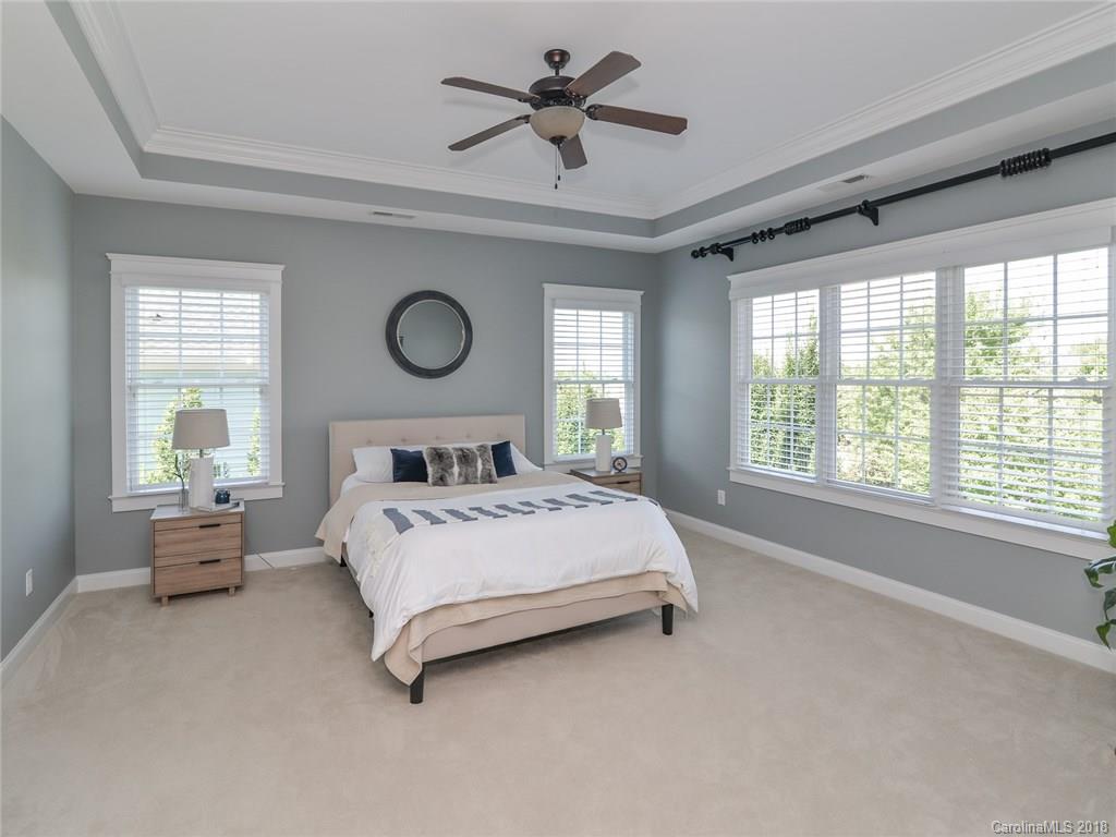 4317 Birkshire Heights Fort Mill, SC 29708 - Photo 14 of 23 a bed sitting in a bedroom next to a window