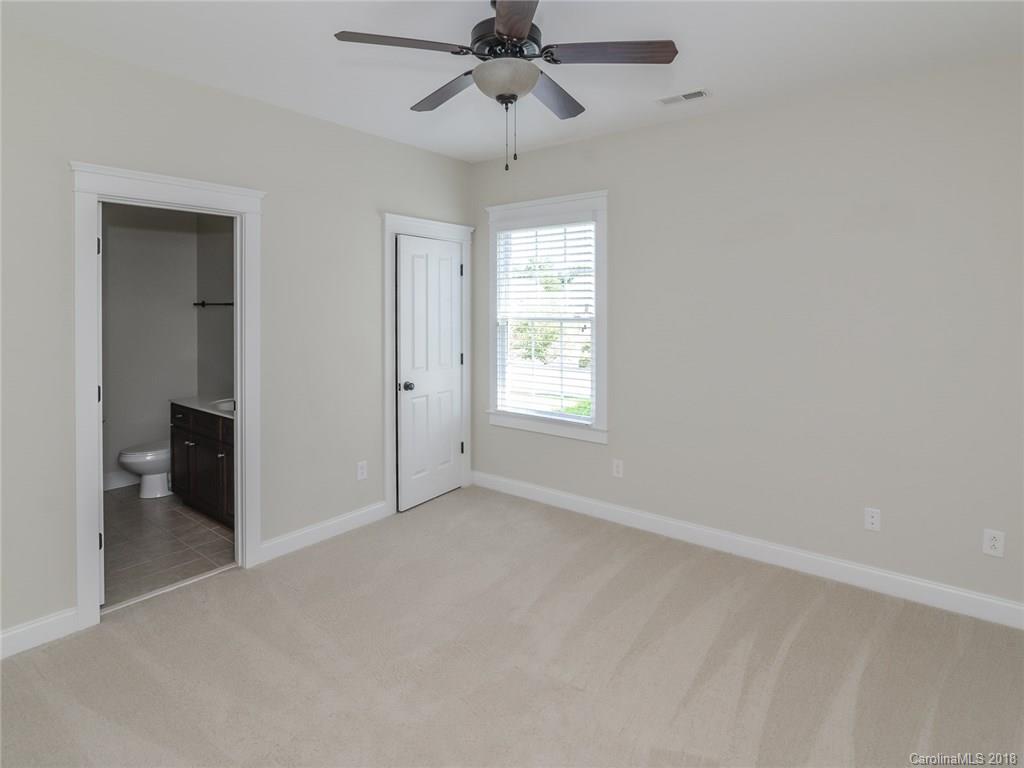 4317 Birkshire Heights Fort Mill, SC 29708 - Photo 17 of 23 an empty room with windows and fan