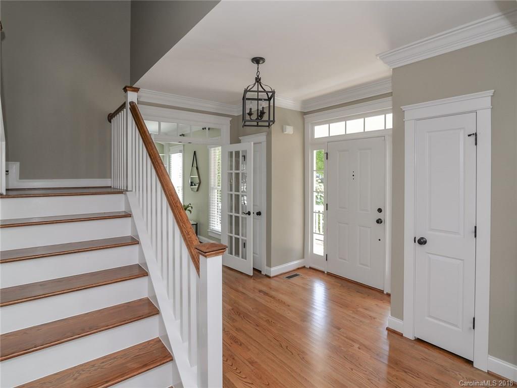 4317 Birkshire Heights Fort Mill, SC 29708 - Photo 3 of 23 a view of a hallway with wooden floor and staircase