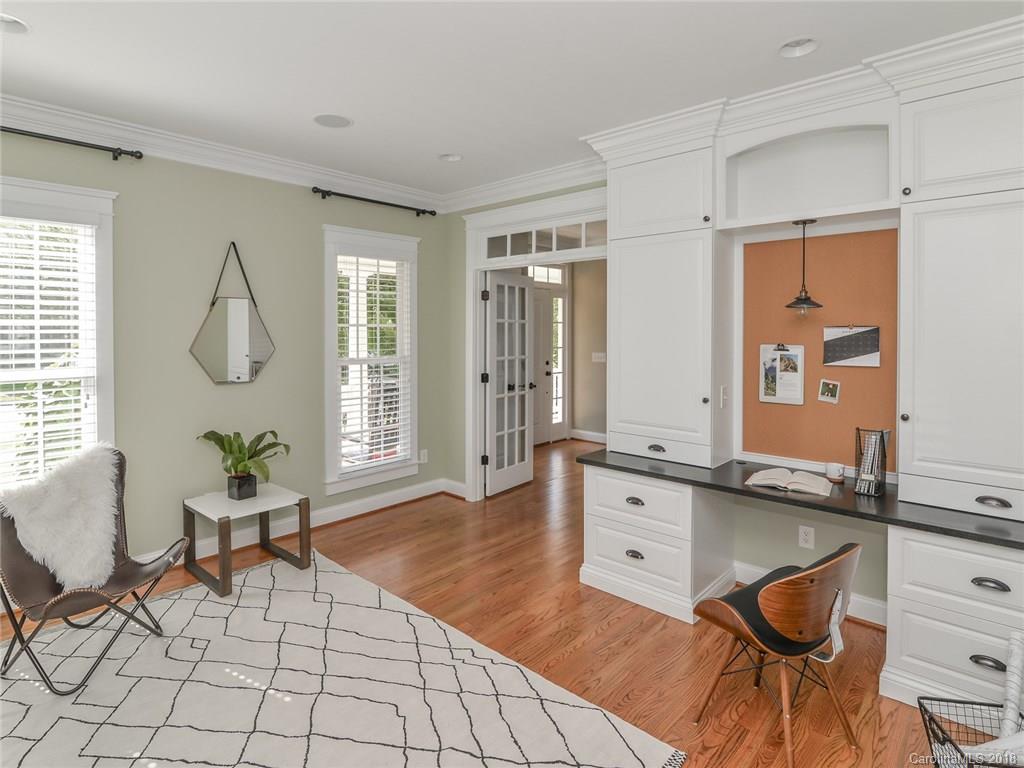 4317 Birkshire Heights Fort Mill, SC 29708 - Photo 5 of 23 a living room with furniture a dining table and wooden floor