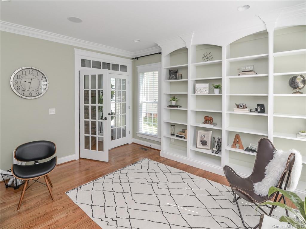 4317 Birkshire Heights Fort Mill, SC 29708 - Photo 6 of 23 a living room with furniture and a book shelf