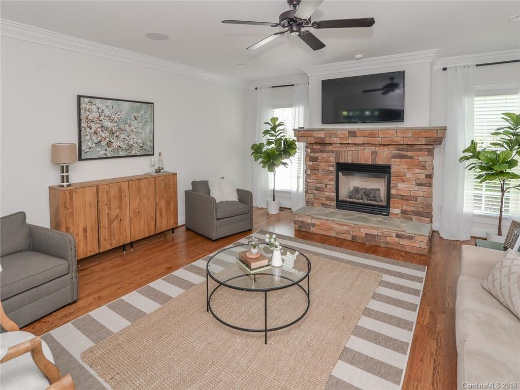 4317 Birkshire Heights Fort Mill, SC 29708 - Photo 7 of 23 a living room with furniture and a fireplace
