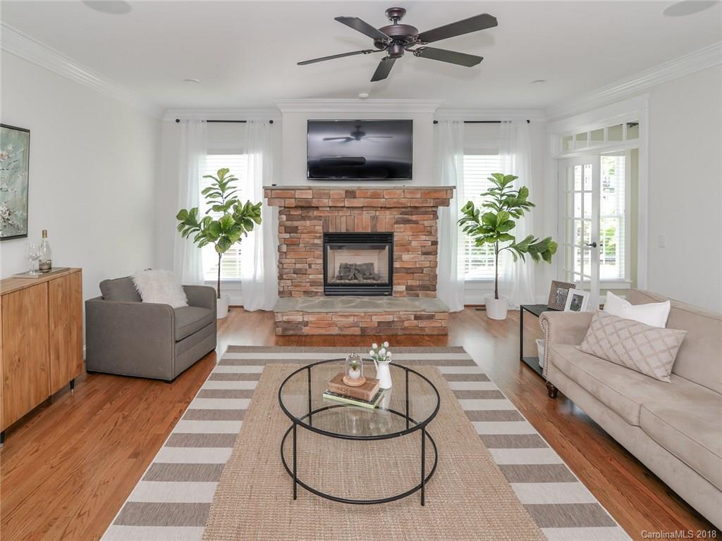 4317 Birkshire Heights Fort Mill, SC 29708 - Photo 8 of 23 a living room with furniture and a fireplace