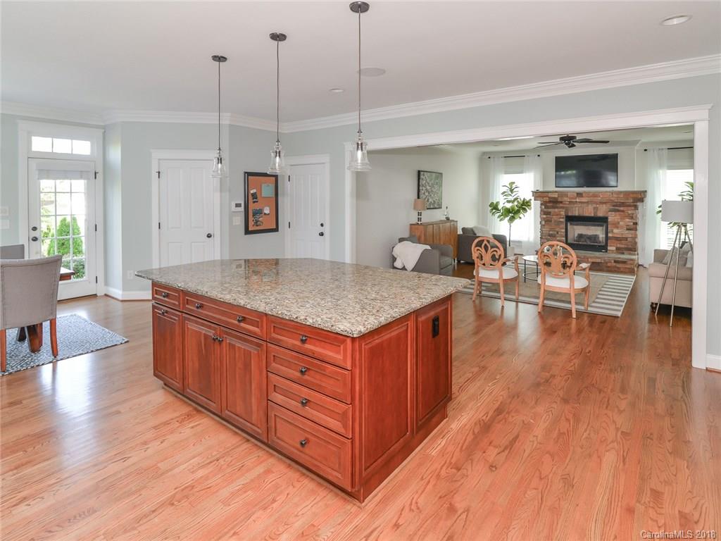 4317 Birkshire Heights Fort Mill, SC 29708 - Photo 10 of 23 a living room with stainless steel appliances granite countertop a sink dishwasher a living room with couches chairs and couches with wooden floor
