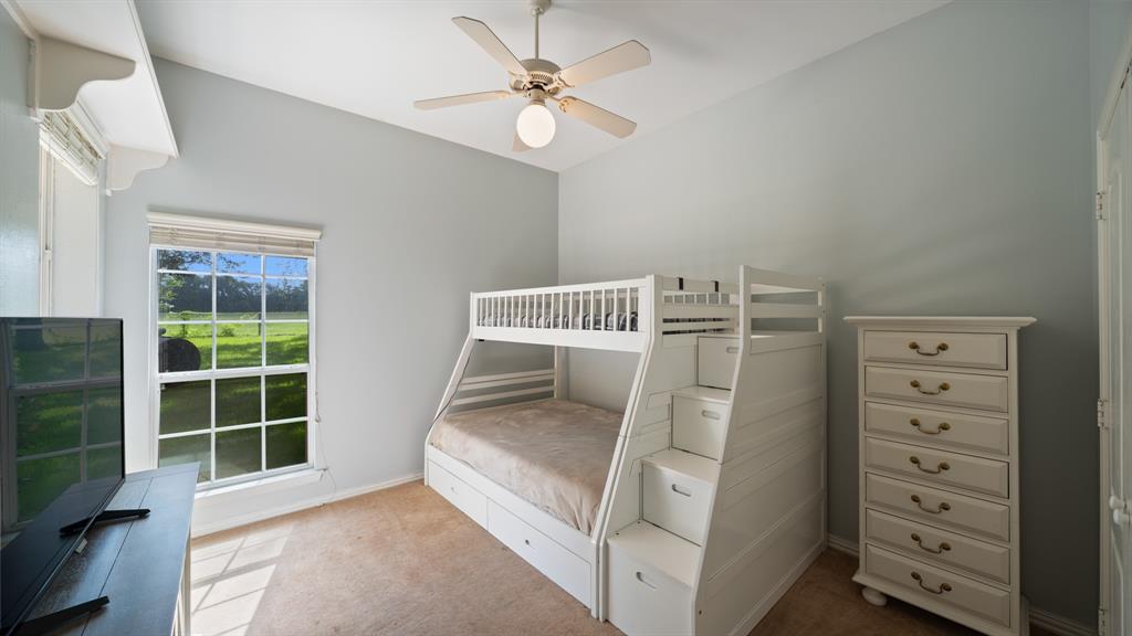 875 Arnold Paul Road Canton, TX 75103 - Photo 19 of 32 a view of bedroom with furniture and flat screen tv
