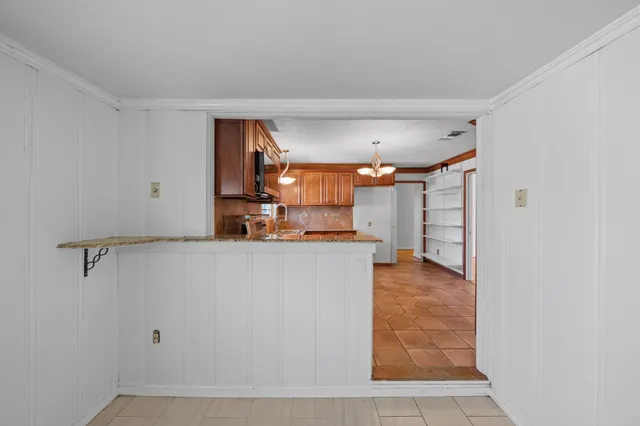 a view of a kitchen with cabinets