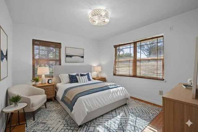 a bedroom with a bed and window