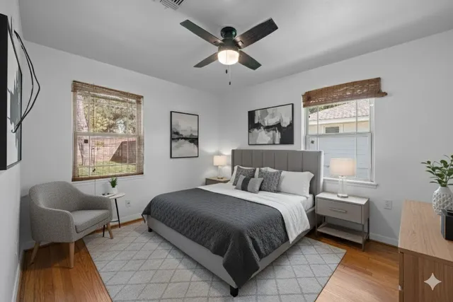 a bedroom with a bed and chair