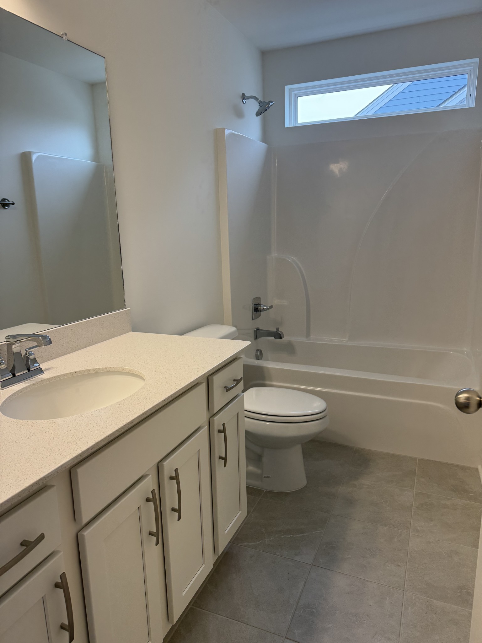 1166 June Wilde Ridge Spring Hill, TN 37174 - Photo 16 of 30 a bathroom with a granite countertop toilet a sink and a mirror