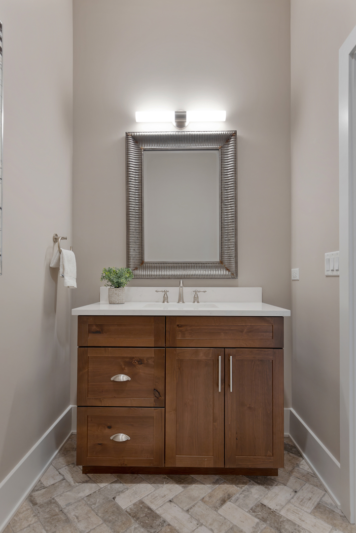 405 North 1st Street Geneva, IL 60134 - Photo 14 of 30 a bathroom with a sink vanity and mirror