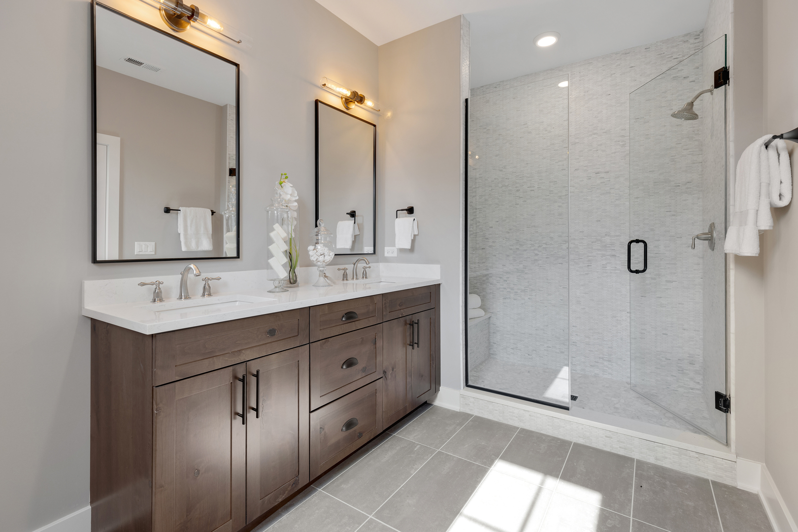 405 North 1st Street Geneva, IL 60134 - Photo 17 of 30 a spacious bathroom with a shower sink and mirror
