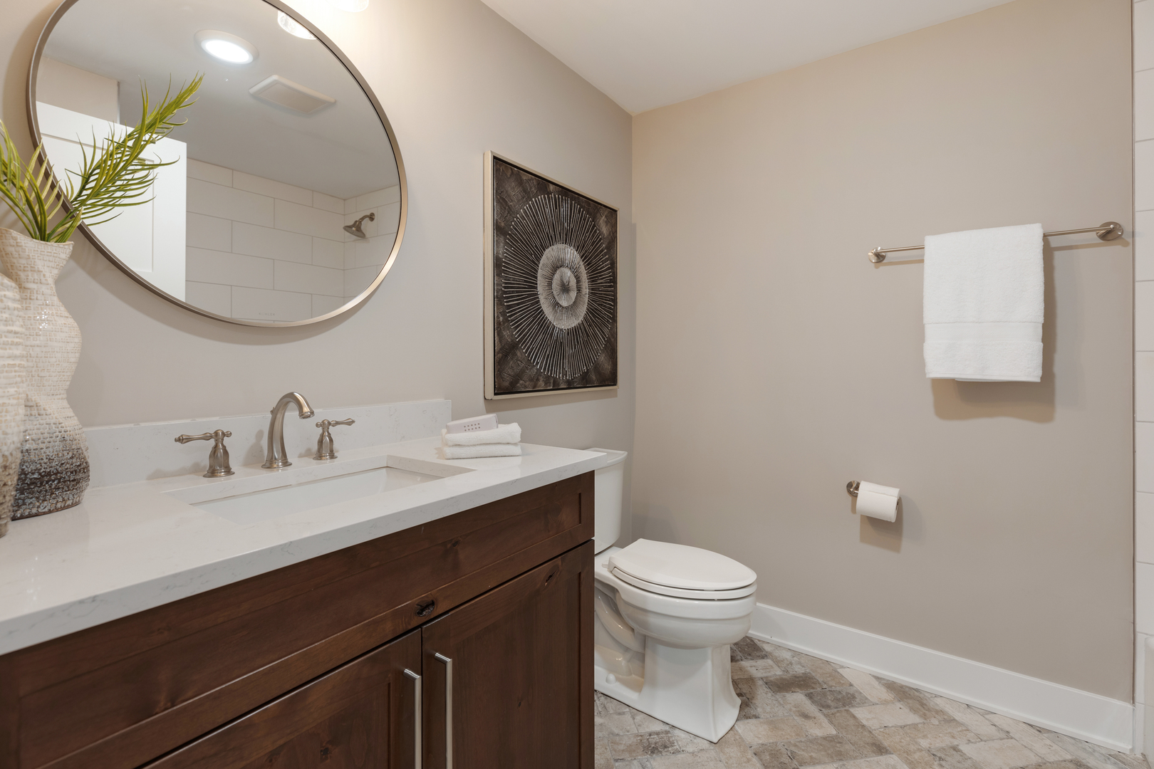 405 North 1st Street Geneva, IL 60134 - Photo 25 of 30 a bathroom with a toilet a sink a mirror and vanity