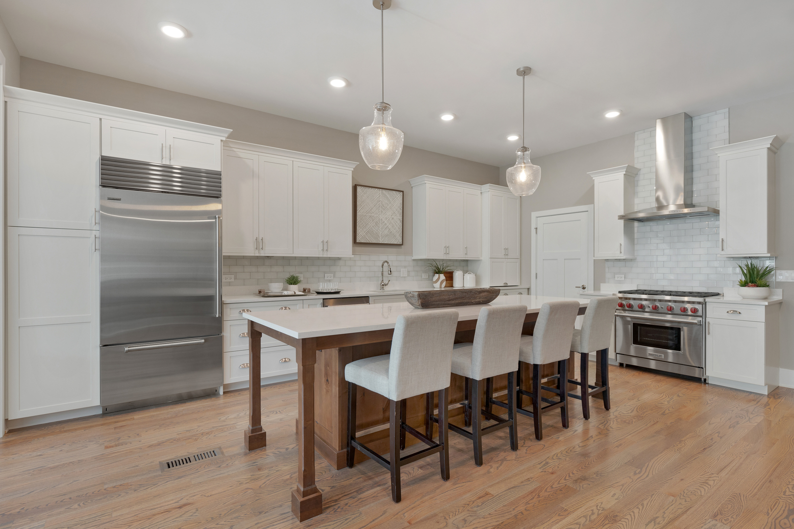 405 North 1st Street Geneva, IL 60134 - Photo 6 of 30 a kitchen with a dining table chairs wooden floor cabinets and appliances