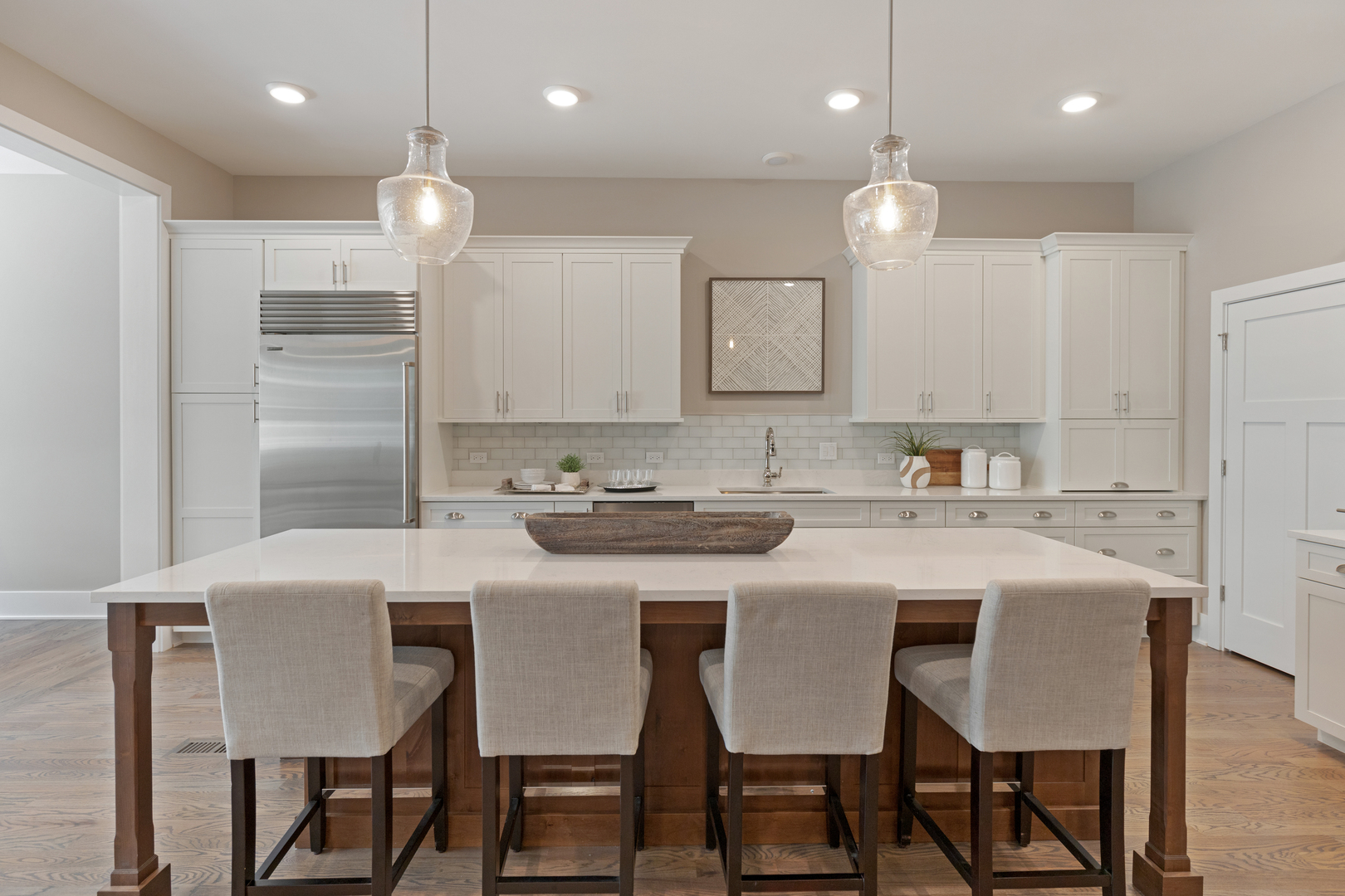 405 North 1st Street Geneva, IL 60134 - Photo 7 of 30 a kitchen with kitchen island granite countertop a table and chairs in it