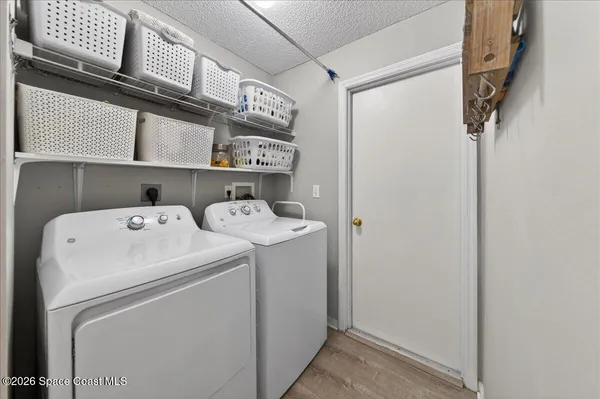 a living room with furniture and a lamp