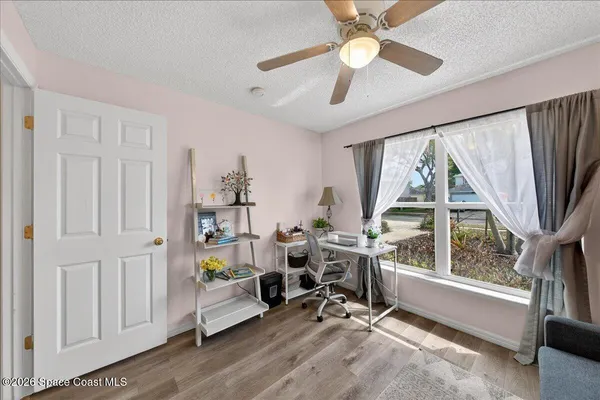 a balcony with furniture and wooden floor