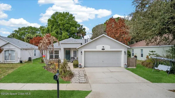 a front view of a house with a large window